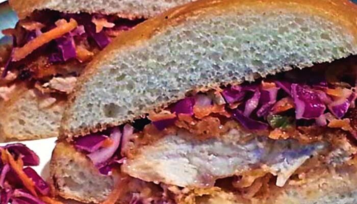 Crispy Buttermilk Fried Chicken Sandwich with Spicy Pickle Slaw and Sriracha Aioli