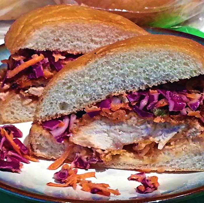 Crispy Buttermilk Fried Chicken Sandwich with Spicy Pickle Slaw and Sriracha Aioli