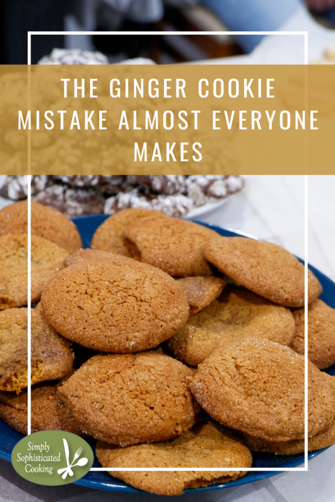 Triple ginger cookies rolled in sugar stacked on a blue plate.