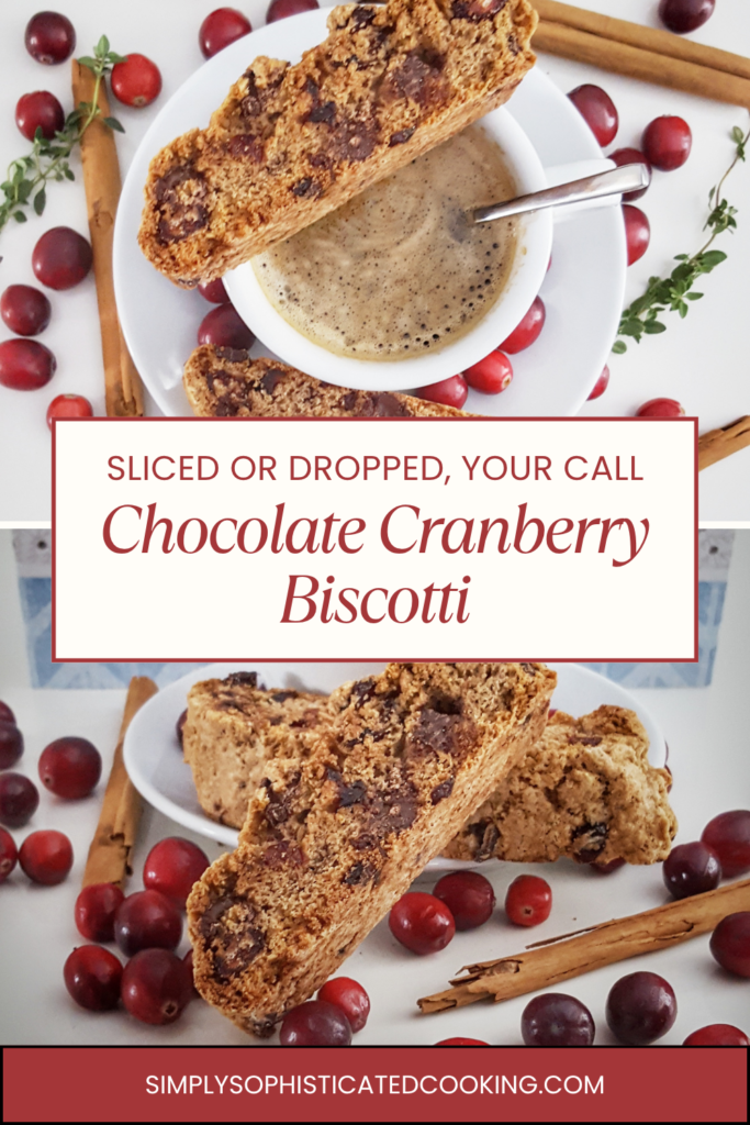 Sliced chocolate cranberry biscotti on a coffee cup showing dark chocolate chips and dried cranberries