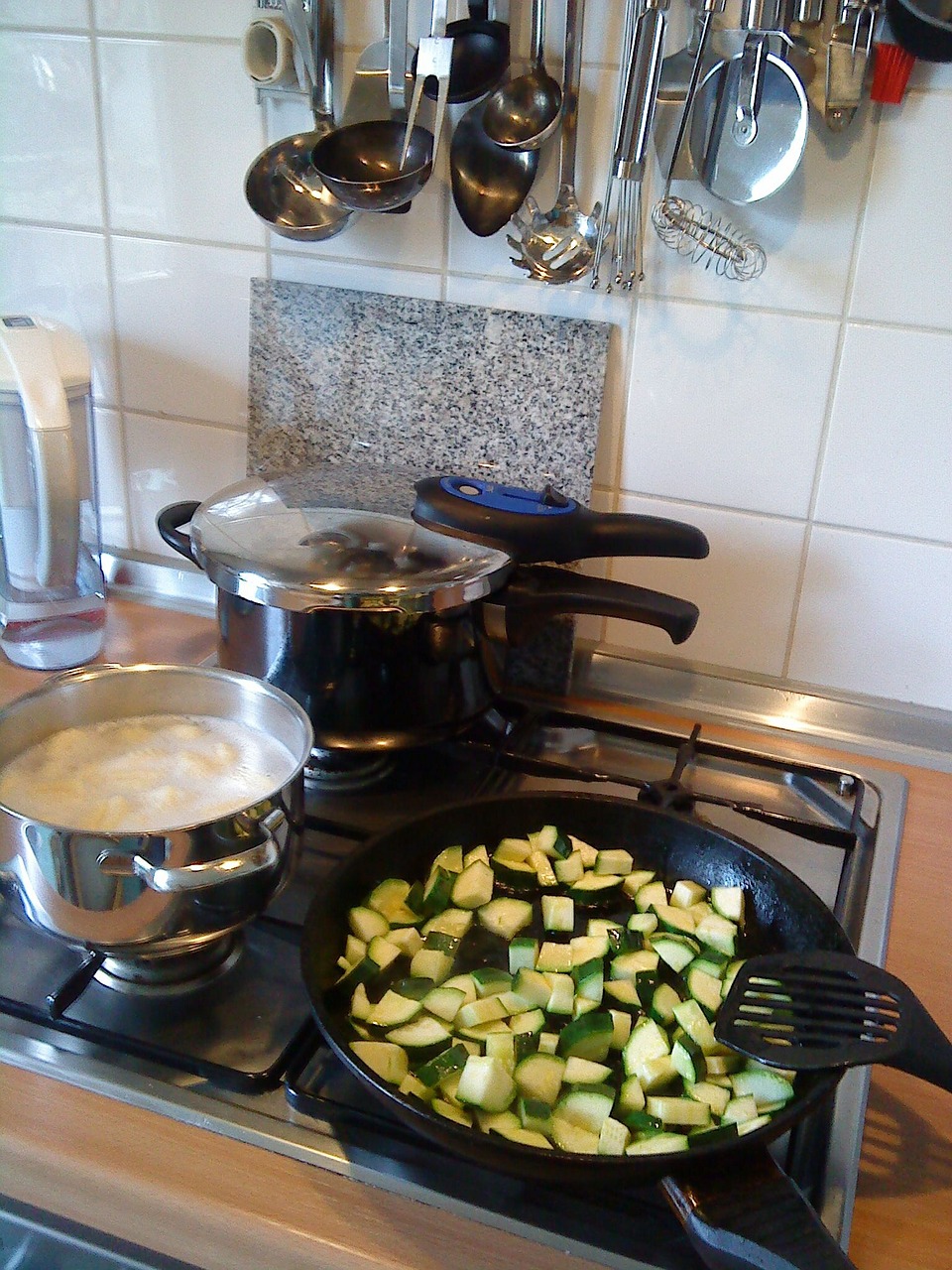kitchen gadgets: pressure cooker and stove