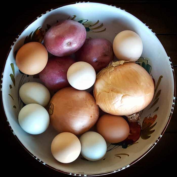 Potatoes, onions, and eggs - the ingredients for an authentic Spanish Tortilla (Tortilla Española or Tortilla de Patatas)
