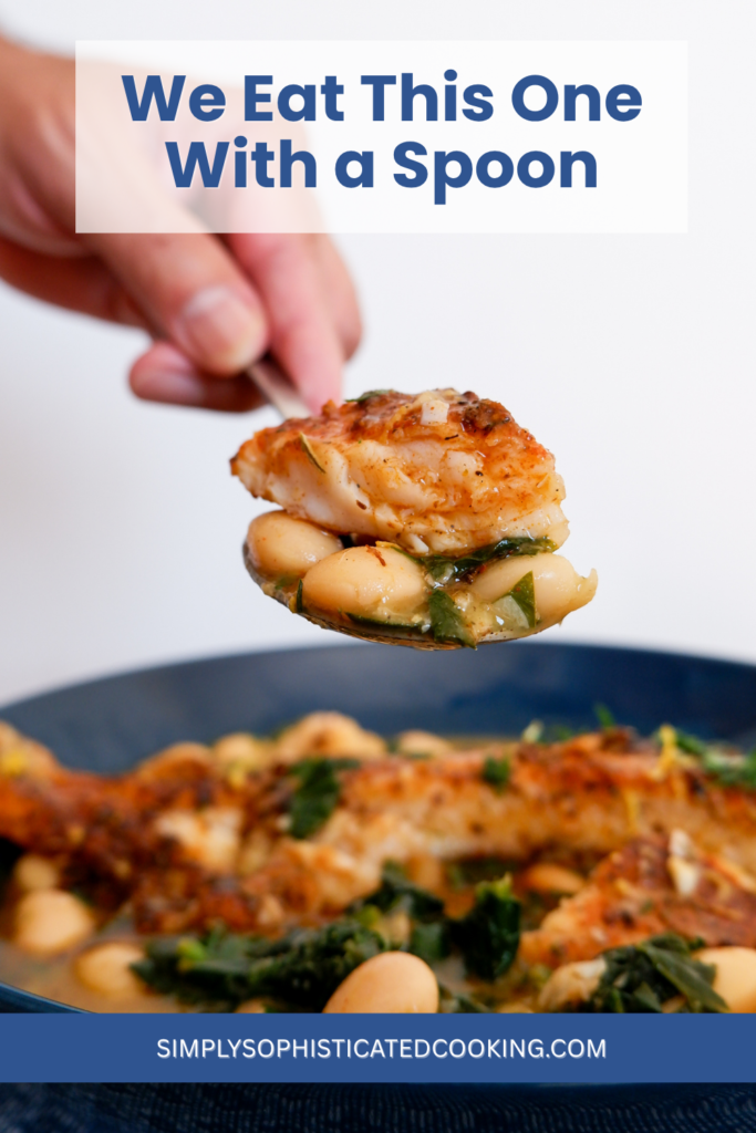 A bowl of seared fish with a spoonful of smoky butter beans and spinach at the table. Mediterranean fish dinner for two
